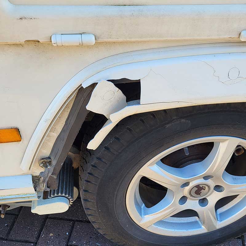 Insurance Repairs - Smashed wheel arch on caravan